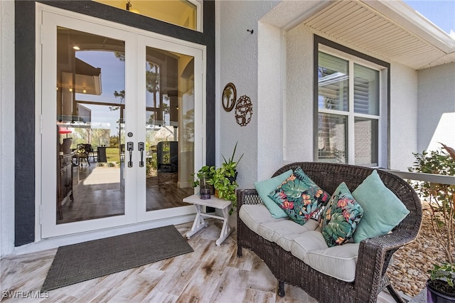 15791 Quail Trl, Bokeelia, FL 33922 - property entrance with french doors and stucco siding