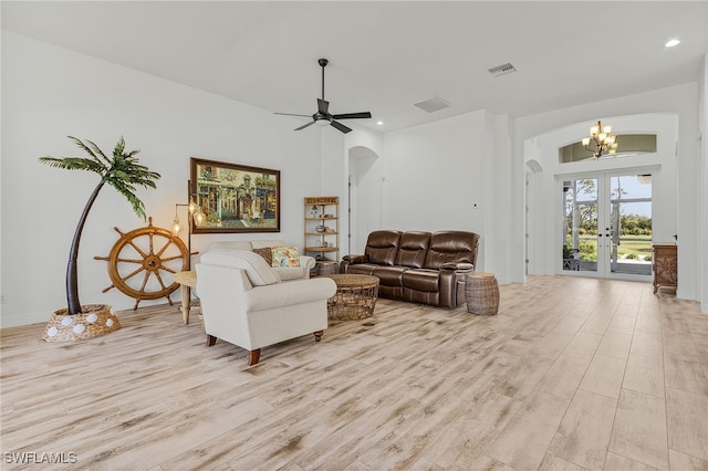 15791 Quail Trl, Bokeelia, FL 33922 - living room with light wood-style floors, arched walkways, visible vents, recessed lighting, and french doors