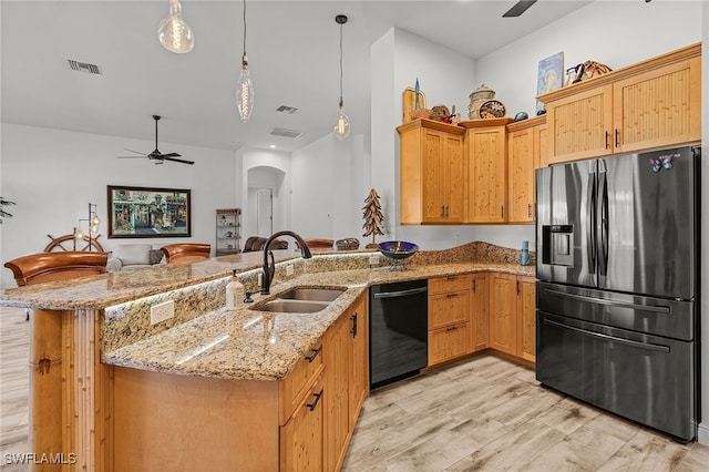 15791 Quail Trl, Bokeelia, FL 33922 - kitchen featuring a ceiling fan, visible vents, stainless steel refrigerator with ice dispenser, black dishwasher, and a sink