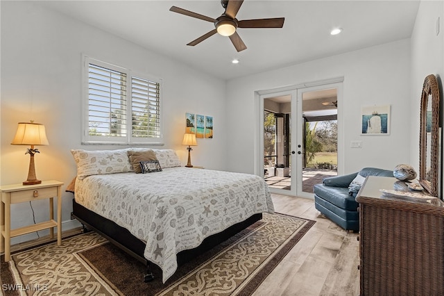 15791 Quail Trl, Bokeelia, FL 33922 - bedroom with light wood-type flooring, french doors, access to outside, and multiple windows