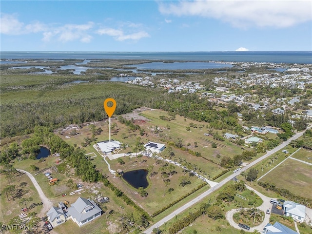 15791 Quail Trl, Bokeelia, FL 33922 - drone / aerial view featuring a water view