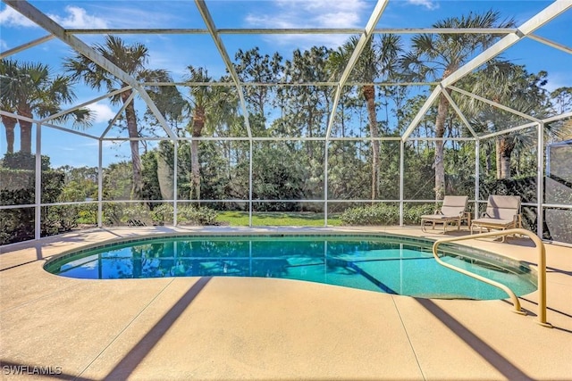 outdoor pool featuring a lanai and a patio area