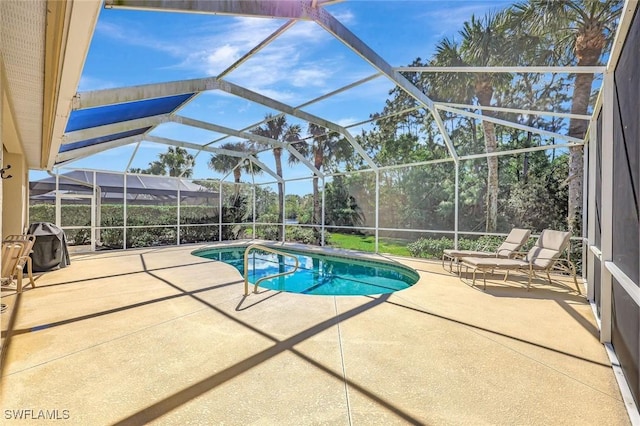 outdoor pool featuring a lanai and a patio area