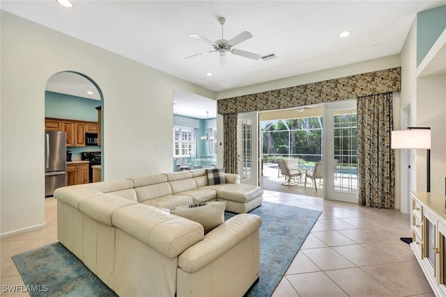 living area featuring recessed lighting, visible vents, and light tile patterned floors