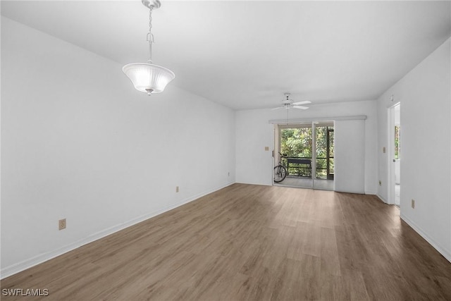 unfurnished room featuring hardwood / wood-style flooring and ceiling fan