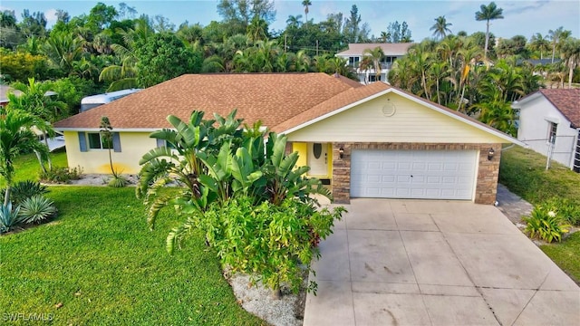 ranch-style home with a garage and a front yard