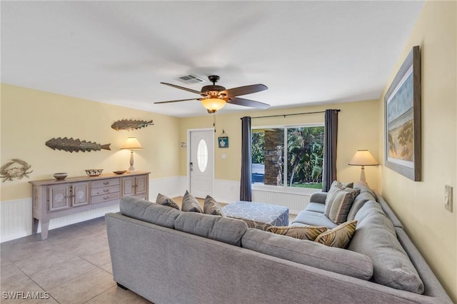 tiled living room featuring ceiling fan