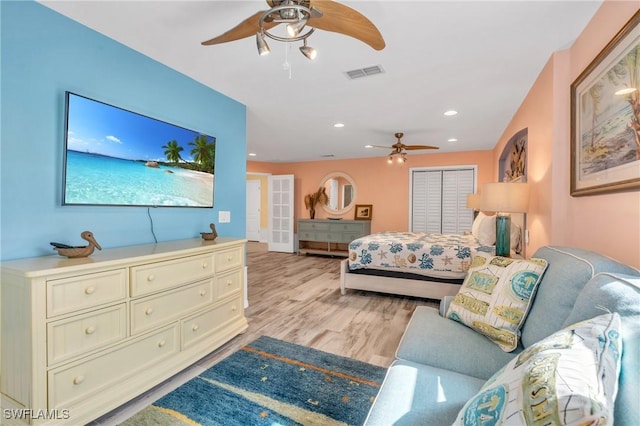 bedroom featuring ceiling fan and light wood-type flooring