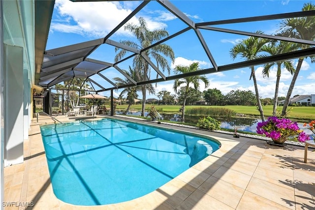 outdoor pool featuring a patio area and glass enclosure