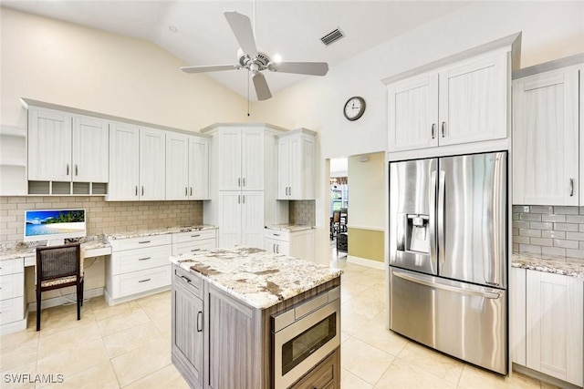 kitchen with light tile patterned floors, stainless steel appliances, visible vents, backsplash, and open shelves