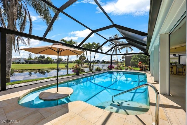 pool with a water view, a patio area, and glass enclosure