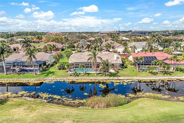 drone / aerial view featuring a water view and a residential view