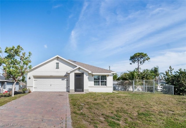 single story home featuring an attached garage, fence, decorative driveway, stucco siding, and a front lawn