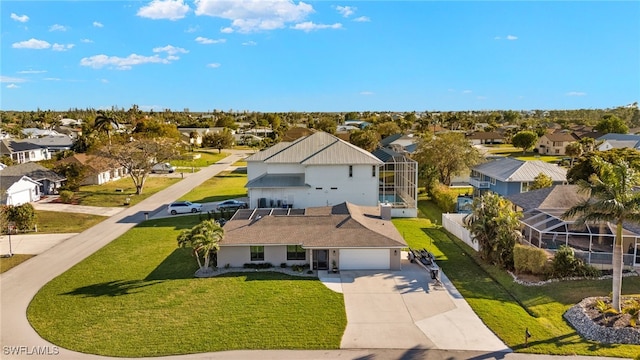 birds eye view of property with a residential view