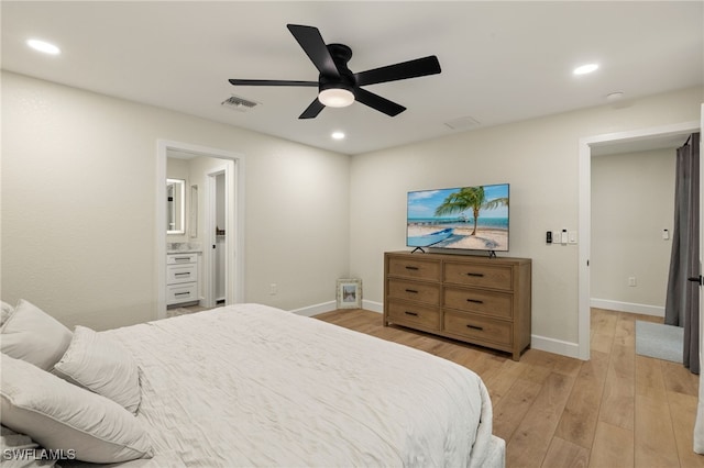 bedroom featuring light wood finished floors, visible vents, and recessed lighting