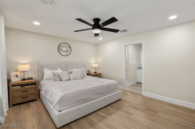 bedroom with baseboards, visible vents, wood finished floors, and recessed lighting