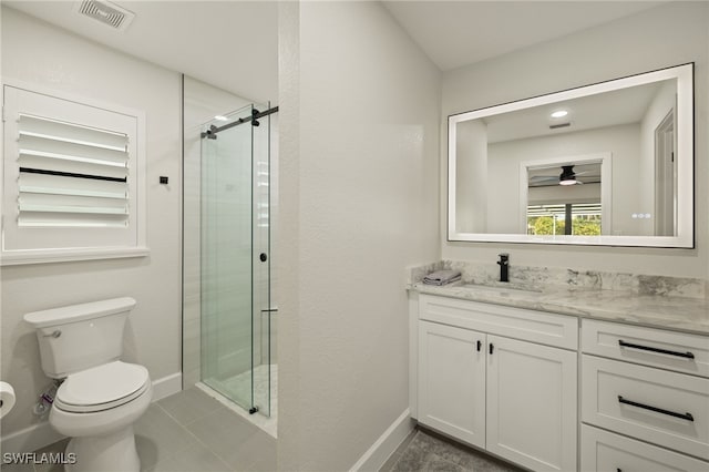 bathroom with visible vents, toilet, a stall shower, vanity, and baseboards