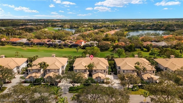 birds eye view of property featuring a residential view, view of golf course, and a water view