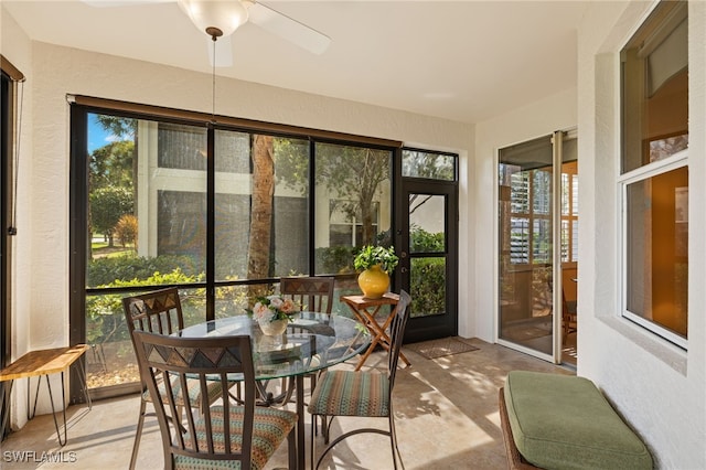 sunroom featuring ceiling fan