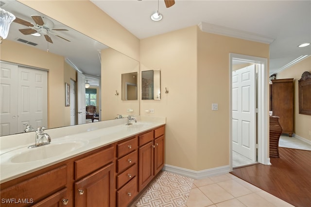 full bathroom with ceiling fan, double vanity, a sink, and visible vents