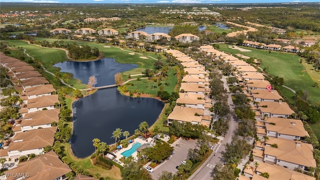 birds eye view of property with a water view and a residential view