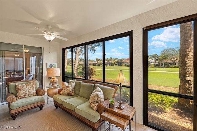 sunroom with ceiling fan