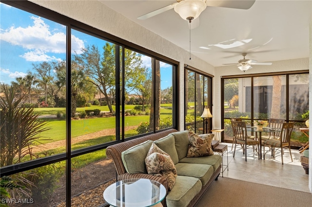 sunroom / solarium featuring ceiling fan