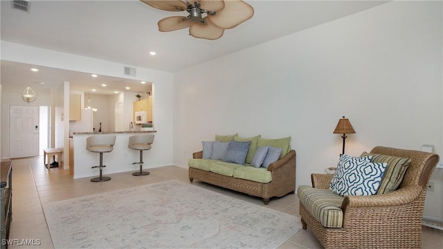 living area featuring recessed lighting, visible vents, and light tile patterned floors