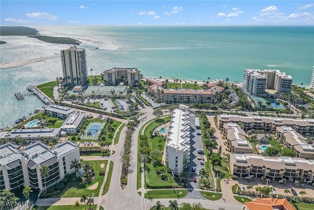 birds eye view of property with a view of city and a water view