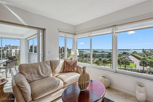 sunroom / solarium with a view of city and a healthy amount of sunlight