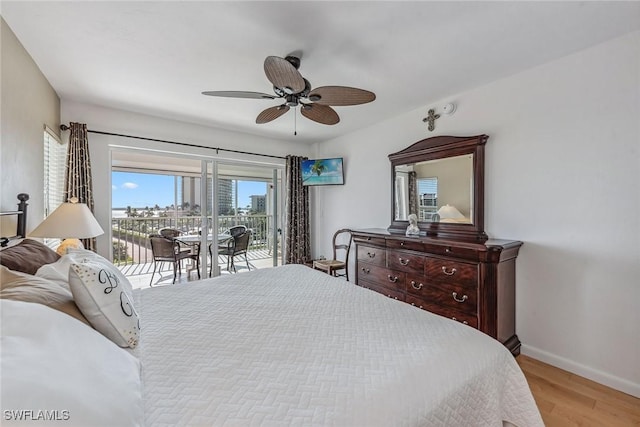 bedroom with light wood-style flooring, baseboards, a ceiling fan, and access to outside