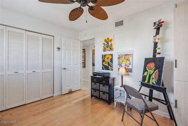 office area featuring visible vents, a ceiling fan, wood finished floors, and baseboards