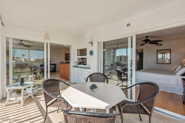 interior space featuring visible vents, ceiling fan, and outdoor dining space