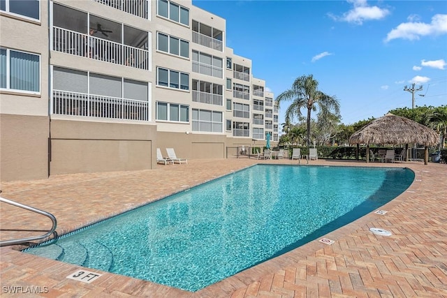 pool featuring a patio and a gazebo