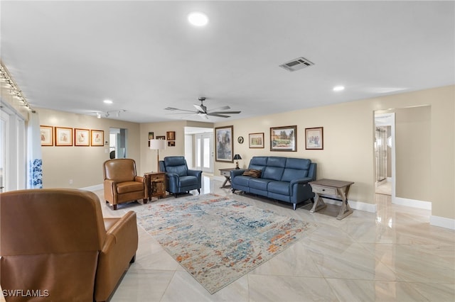 living area featuring baseboards, visible vents, ceiling fan, and recessed lighting