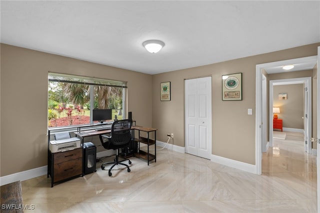 office with marble finish floor and baseboards