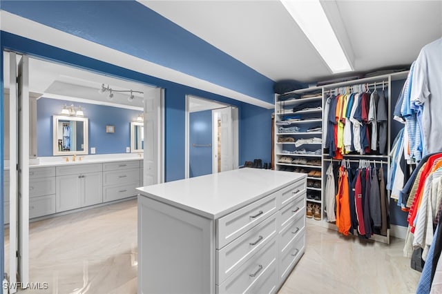 spacious closet with a sink