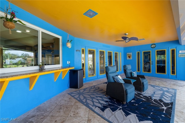 view of patio / terrace featuring a ceiling fan and french doors