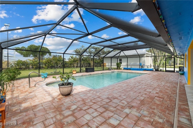 outdoor pool featuring a patio and glass enclosure