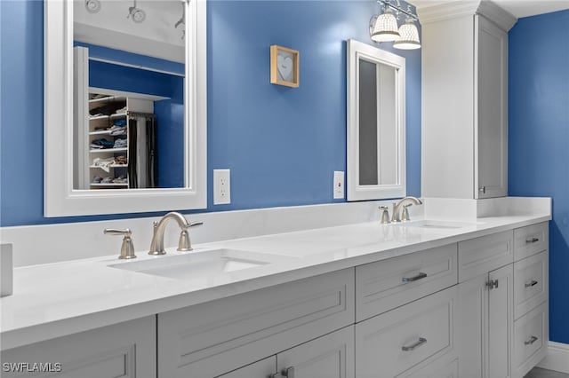 full bathroom featuring double vanity and a sink