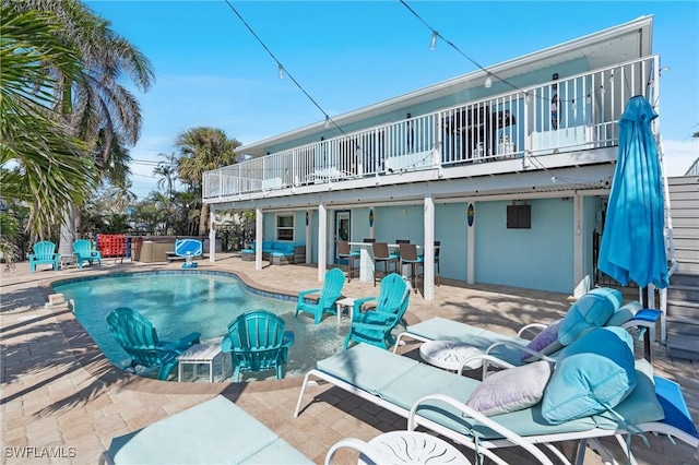 view of pool featuring a patio and a fenced in pool