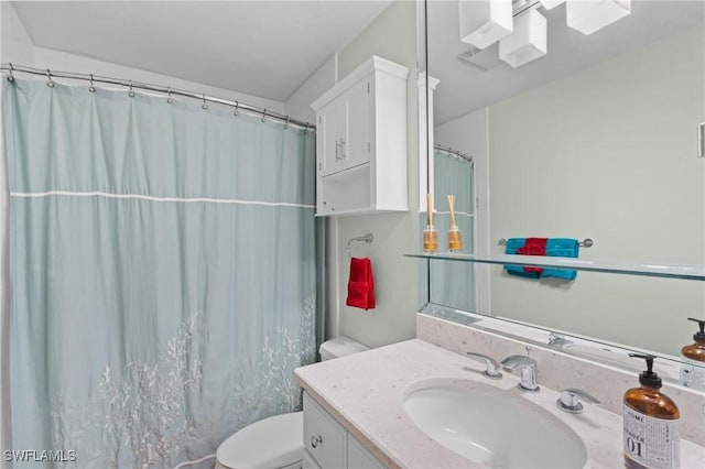 full bathroom with toilet, a shower with curtain, and vanity