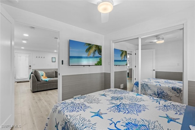 bedroom featuring light wood finished floors and ceiling fan