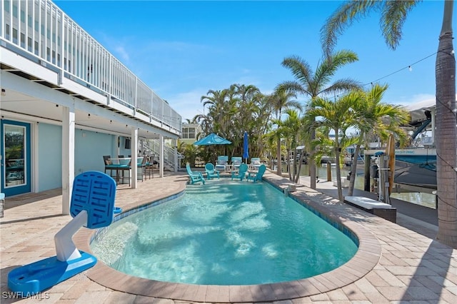 outdoor pool featuring a patio