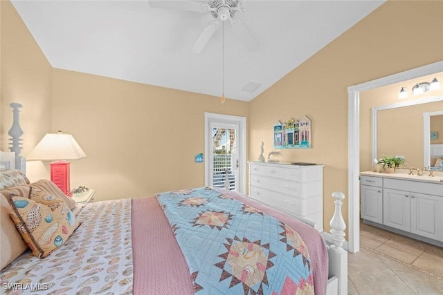 bedroom featuring light tile patterned floors, a ceiling fan, connected bathroom, vaulted ceiling, and a sink