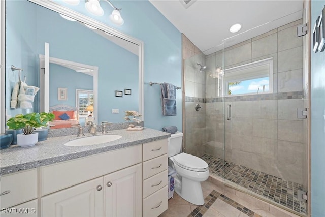 ensuite bathroom featuring toilet, ensuite bath, tile patterned flooring, vanity, and a shower stall