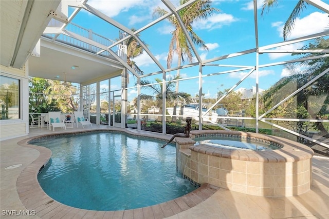 view of pool featuring glass enclosure, a patio area, and a pool with connected hot tub