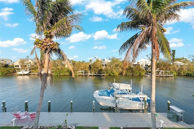 view of dock with a water view, boat lift, and central air condition unit