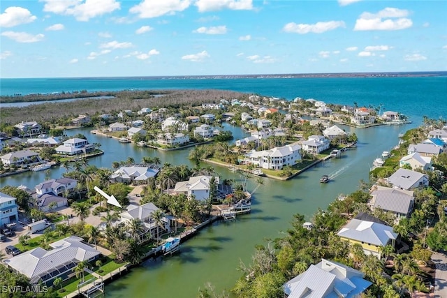 aerial view with a water view and a residential view