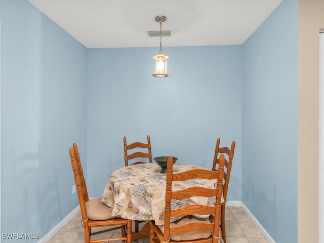 dining space with light tile patterned floors